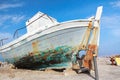 Old veteran ruined fishing boat in beach shore on Greek Kos island Mastihari bay Royalty Free Stock Photo