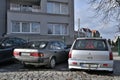 Old veteran vintage classic dented Japanese car Mitsubishi Carisma and Toyota carina II Royalty Free Stock Photo