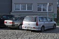 Old veteran vintage classic dented Japanese car Mitsubishi Carisma and Toyota carina II Royalty Free Stock Photo