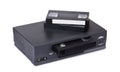 Old VHS video recorder and cassettes Royalty Free Stock Photo