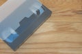 Old VHS Video tape cassette put on wooden table. Royalty Free Stock Photo