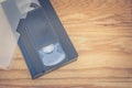 Old VHS Video tape cassette put on wooden table. Royalty Free Stock Photo