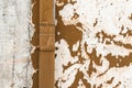 Old vibrant orange wall aged pipe exterior weathered paint chapped surface detail Royalty Free Stock Photo