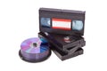 Old Video Cassette tapes with a DVD disc isolated Royalty Free Stock Photo