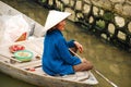 Old vietnam woman on the boat on the river