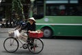 An old vietnamese women stop and selling street food on the busy street. Ho Chi Minh city, Vietnam, 17 March 2017. Royalty Free Stock Photo