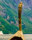 Old viking boat and ferryboat on fjord, Norway