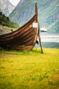 Old viking boat and ferryboat in norwegian fjord Royalty Free Stock Photo