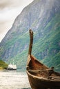 Old viking boat and ferryboat in norwegian fjord Royalty Free Stock Photo