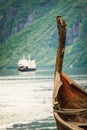Old viking boat and ferryboat in norwegian fjord Royalty Free Stock Photo