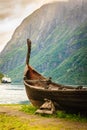 Old viking boat and ferryboat in norwegian fjord Royalty Free Stock Photo