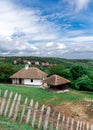 Old vilage house and cloudy sky.