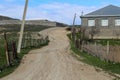 Old village with old gray houses and empty roads