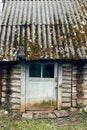 old village house bathhouse with door on the farm in spring