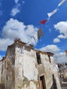 Old village house flags wind Royalty Free Stock Photo