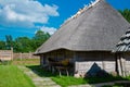 The old village with logboat. building under a reed roof with logboat Royalty Free Stock Photo