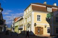 Old village wooden house in Parnu, Estonia. Village near baltic sea, resort for summer holidays. People in the street