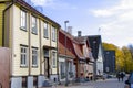 Old village wooden house in Parnu, Estonia. Village near baltic sea, resort for summer holidays. People in the street