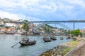 old vinery ships at river Duoro with skyline of Porto in background and bridge ponte luis I in Gaia, Porto, Portugal