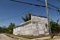 Old vintage abandoned historic white wooden small building