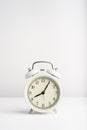 Old vintage alarm clock on the white background. Royalty Free Stock Photo