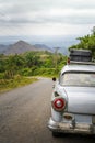 Old vintage American car on a road outside Trinidad Royalty Free Stock Photo