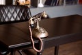 Old vintage antique candlestick telephone on the business working table working on the past Royalty Free Stock Photo