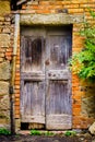 Old, vintage, antique door in Montalcino, Italy Royalty Free Stock Photo