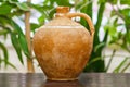 Old vintage antique earthenware jug on the table. Vintage style. Vessel for water , made for Scythian