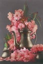 Old, vintage antique mocha coffee pot decorated with cherry blossom flowers, dark moody shot