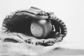 Old vintage ball in leather mitt, grunge baseball equipment image. Great for sports team or hardball player graphic.
