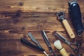 Old vintage barbershop tools on wooden table.