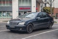 Old vintage big elegant German black sedan car Mercedes-Benz parked