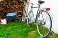 Old vintage bike near pile of wood Royalty Free Stock Photo