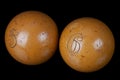 Old vintage billiard balls, number five and six. On black Royalty Free Stock Photo