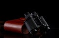 Old vintage binoculars with case isolated on black background, travel concept Royalty Free Stock Photo