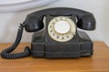 Old vintage black bakelite telephone instrument Royalty Free Stock Photo