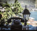 Old vintage black phone on the table at the window