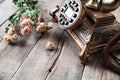 Old vintage black rotary phone and a bouquet of roses on wooden background Royalty Free Stock Photo