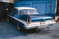 Old Vintage blue with white roof Plymouth Belvedere parked on the sideway on sunny day after the rain Royalty Free Stock Photo