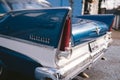 Old Vintage blue with white roof Plymouth Belvedere parked on the sideway on sunny day after the rain Royalty Free Stock Photo