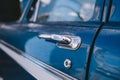 Old Vintage blue with white roof Plymouth Belvedere parked on the sideway on sunny day after the rain Royalty Free Stock Photo