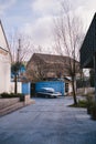 Old Vintage blue with white roof Plymouth Belvedere parked on the sideway on sunny day after the rain Royalty Free Stock Photo