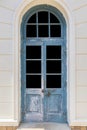 Vintage blue wood door ,Building entrance and white stone wall Royalty Free Stock Photo