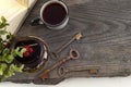 Old vintage books, cup of tea, cake and keys on rustic wooden table Royalty Free Stock Photo