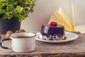 Old vintage books, cup of tea, cake and keys on rustic wooden table Royalty Free Stock Photo