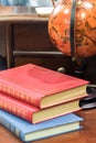 Old vintage books and globe on table Royalty Free Stock Photo