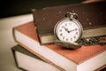 Old vintage books and pocket watches Royalty Free Stock Photo