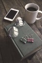 Old vintage books, smartphone and glasses on a wooden table Royalty Free Stock Photo