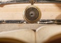 Old vintage books and a watch.Antique pocket watch on opened Royalty Free Stock Photo